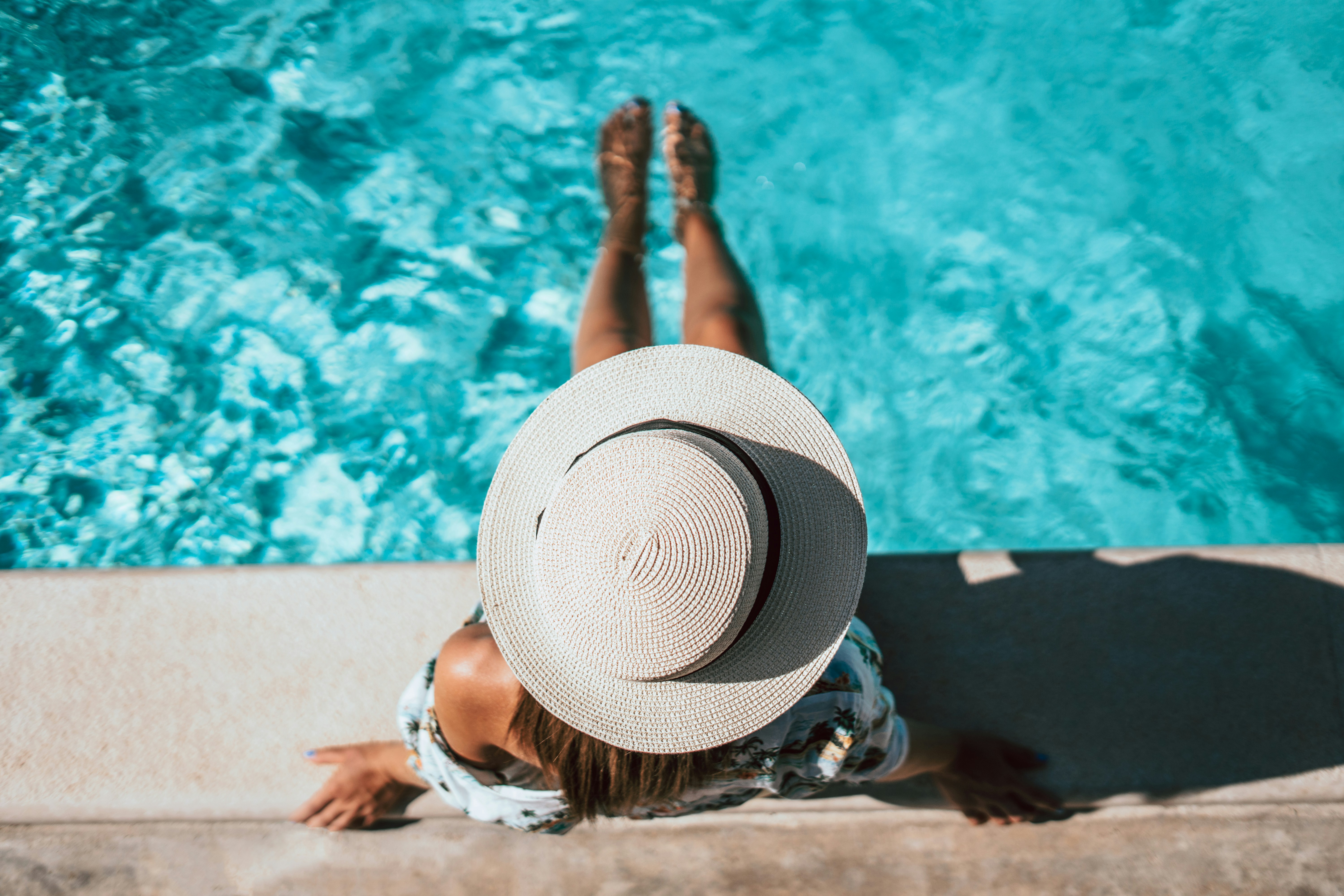 Sparkling blue swimming pool with clear water and tile details
